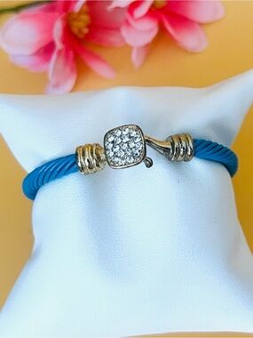 Blue enamel cuff bracelet with paved gold tone closure